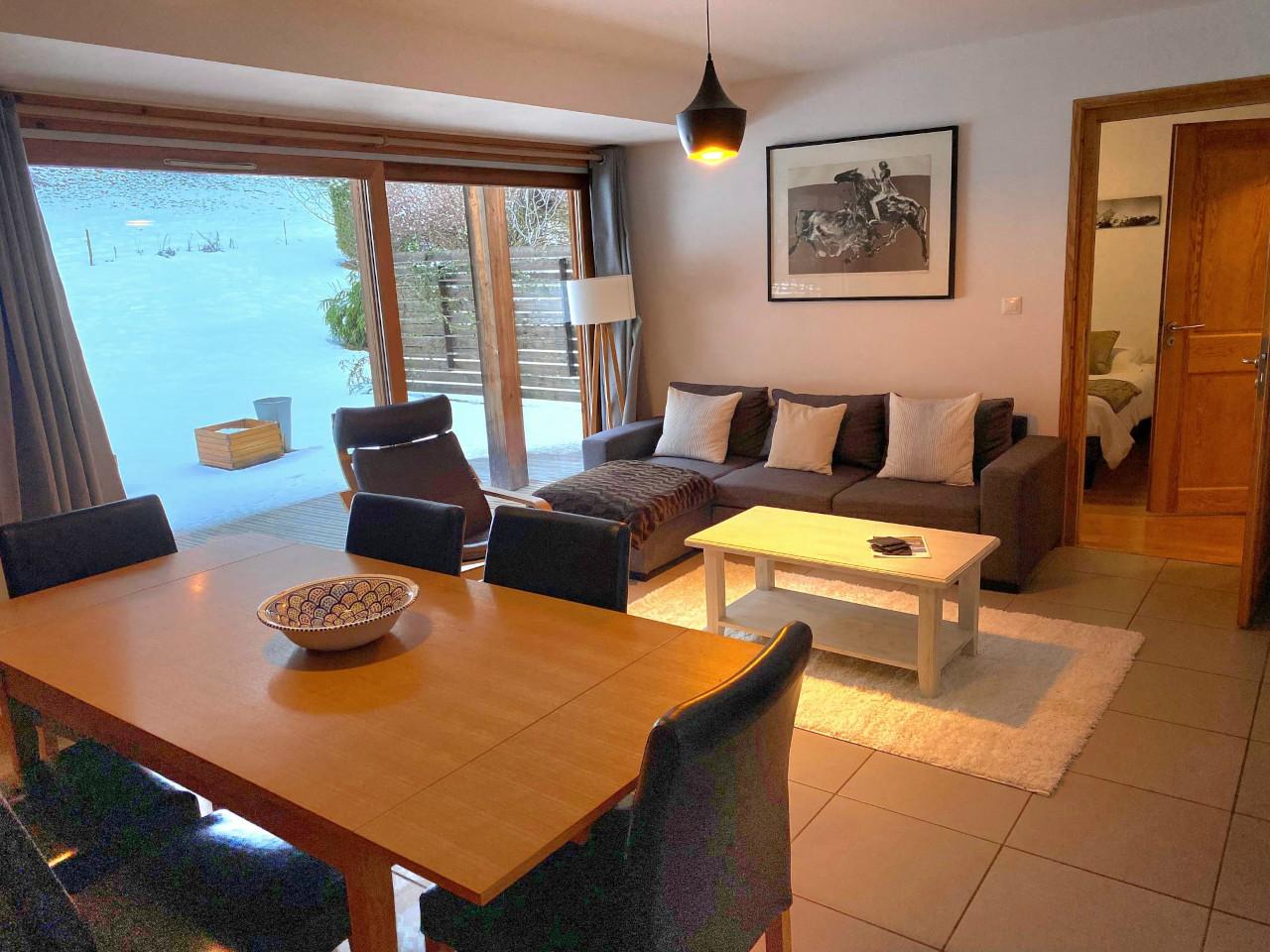 Open plan living dining area with sofabed. Table seats 8